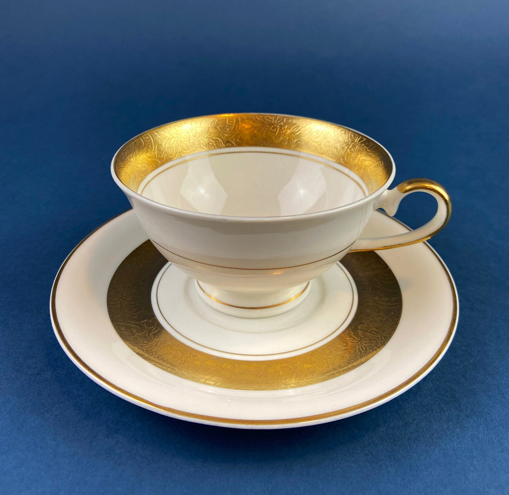 Antique Bavarian Porcelain Tea Trio. Winterling Roslaw. Cup, Saucer, and Dessert Plate in Gold and Pink. Modern Lotus Pattern.