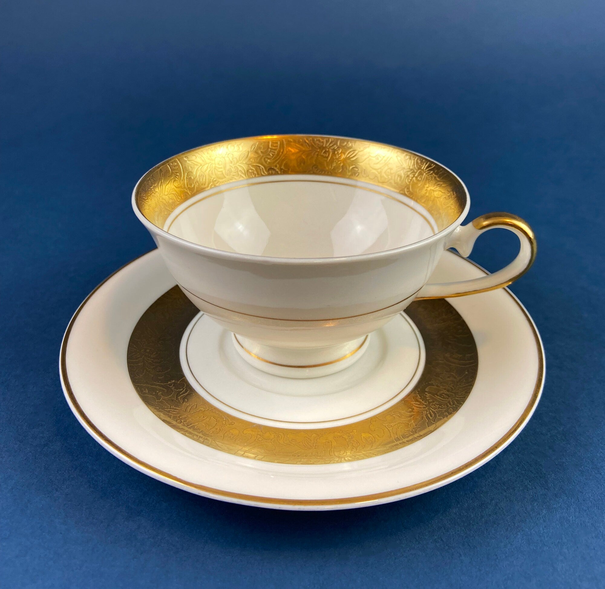 Antique Bavarian Porcelain Tea Trio. Winterling Roslaw. Cup, Saucer, and Dessert Plate in Gold and Pink. Modern Lotus Pattern.